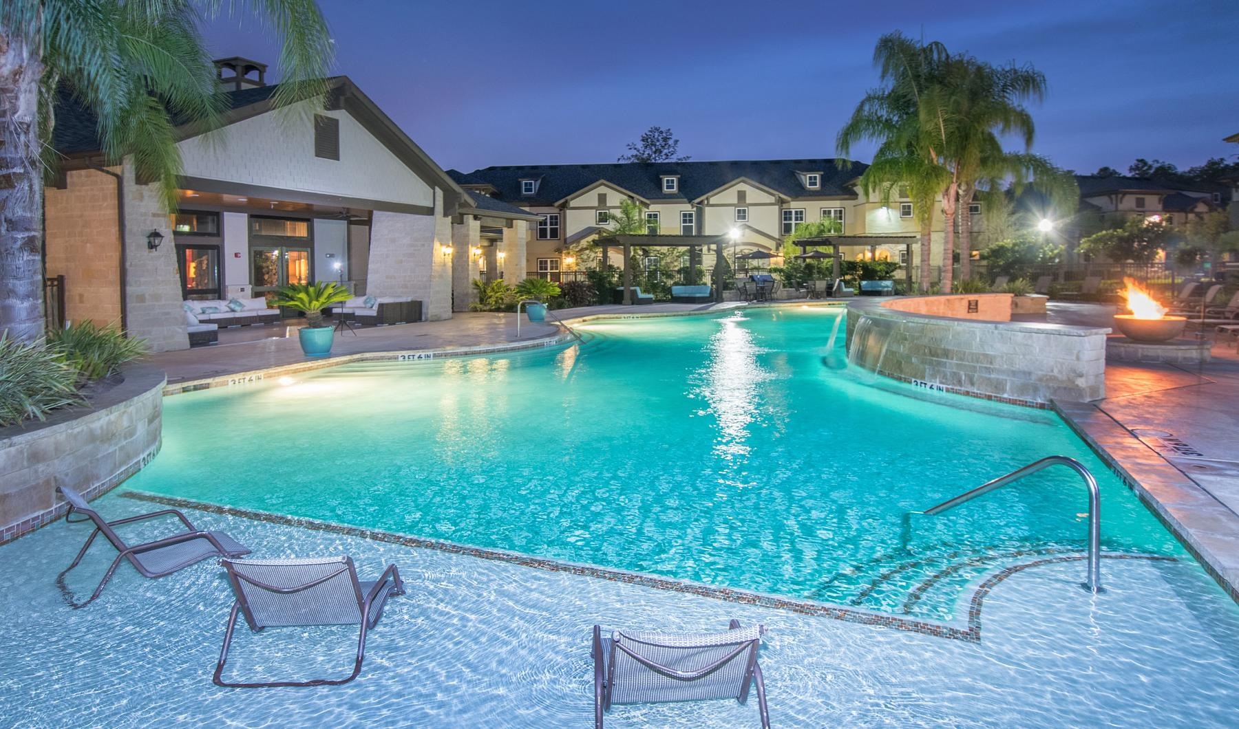 a pool with chairs around it